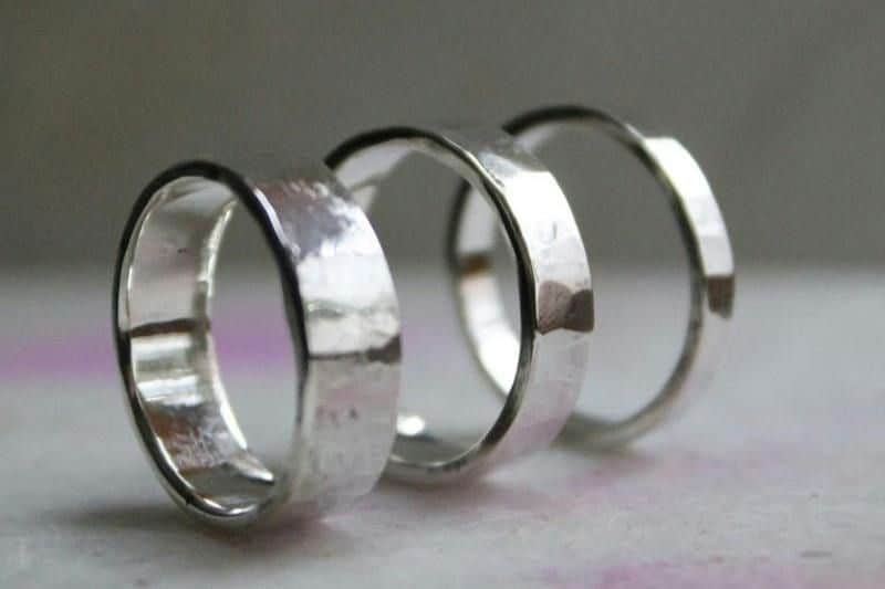 Drury Street Dublin: Forge a Silver Ring Experience Three silver rings with a hammered texture are aligned in a row against a light-colored background.